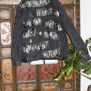 Black Jean Jacket with Jimmy Hendrix Song Quote in his handwriting on the back.